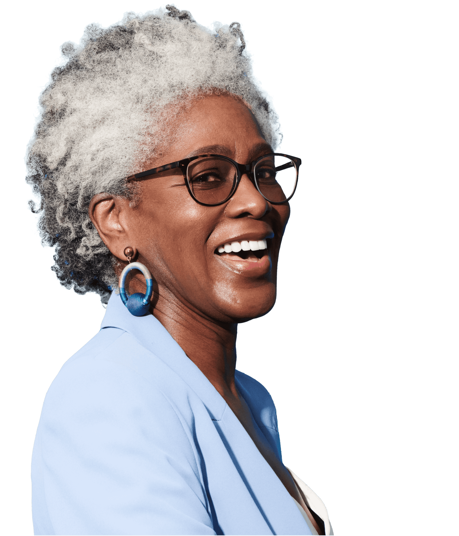 Lady smiling who has gray hair and wearing glasses.